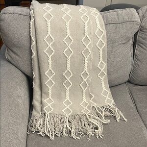 Grey and white knit throw blanket